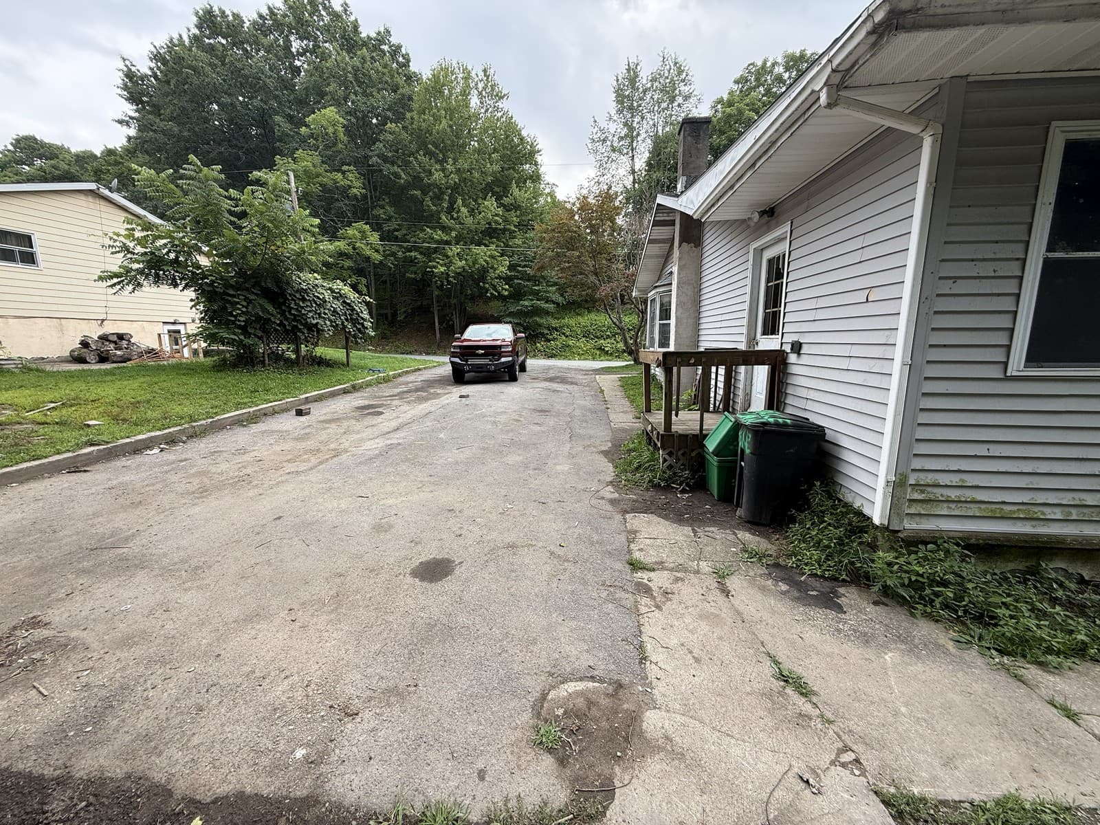 Paved driveway and side entrance