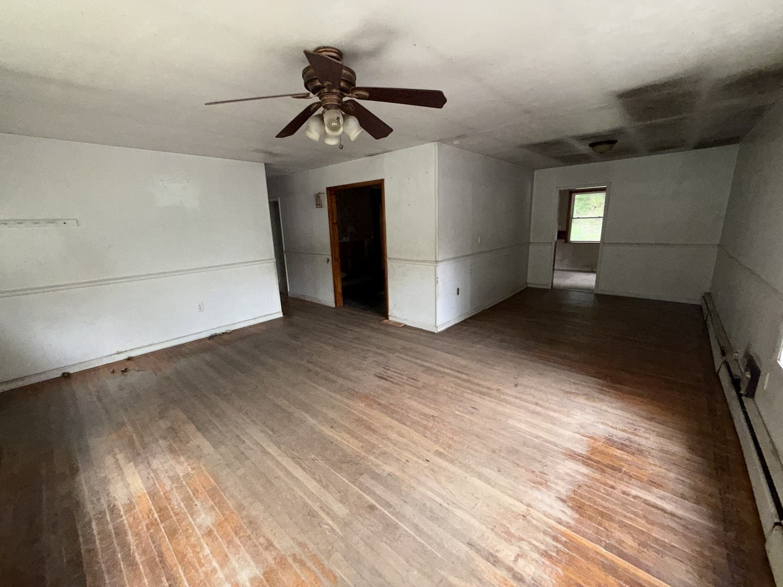 Living area; ceiling and wall condition visible